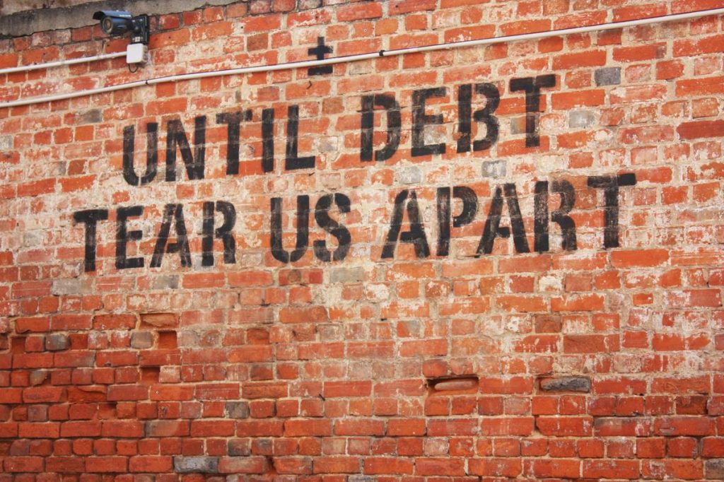 a brick wall with a message written on it